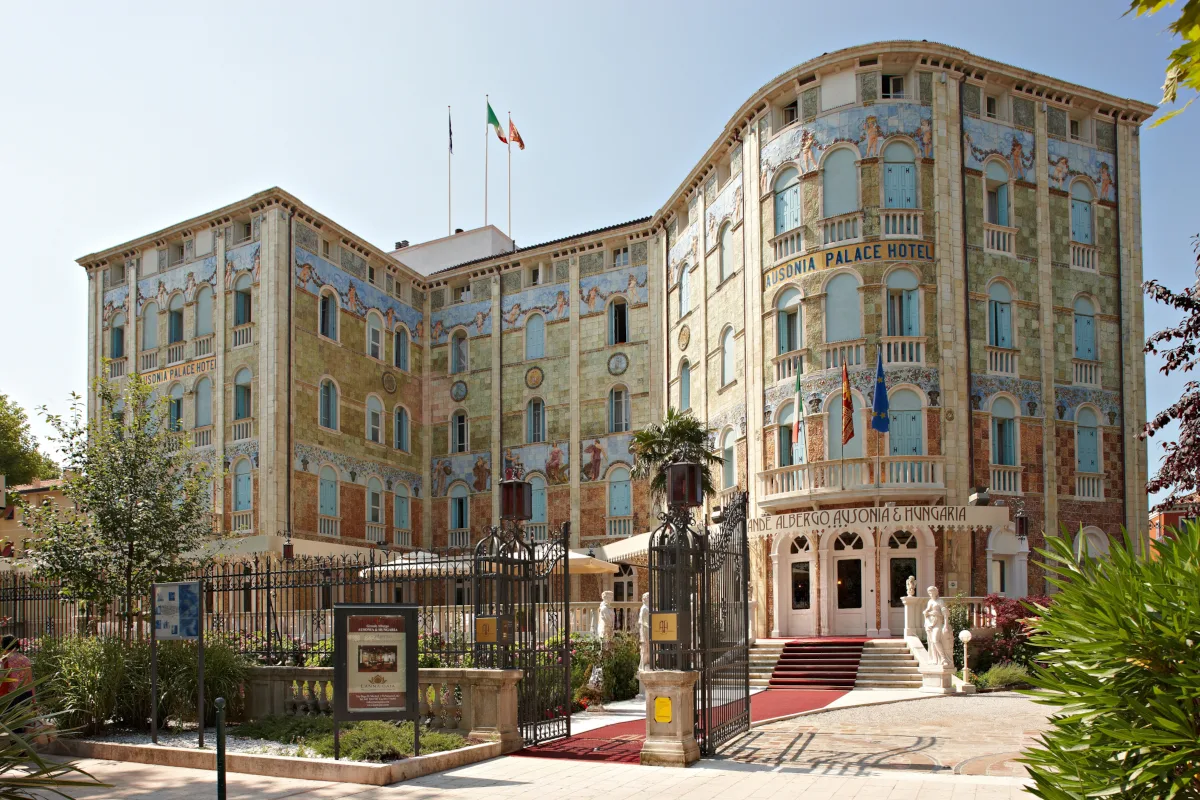 Ausonia Hungaria Liberty-style facade on Gran Viale Santa Maria Elisabetta with floral Art Nouveau mosaics and wrought-iron balcony